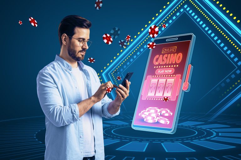 online-casino-gaming-gambling-device-concept-thoughtful-european-man-smartphone-with-creative-slot-machine-other-games (1)